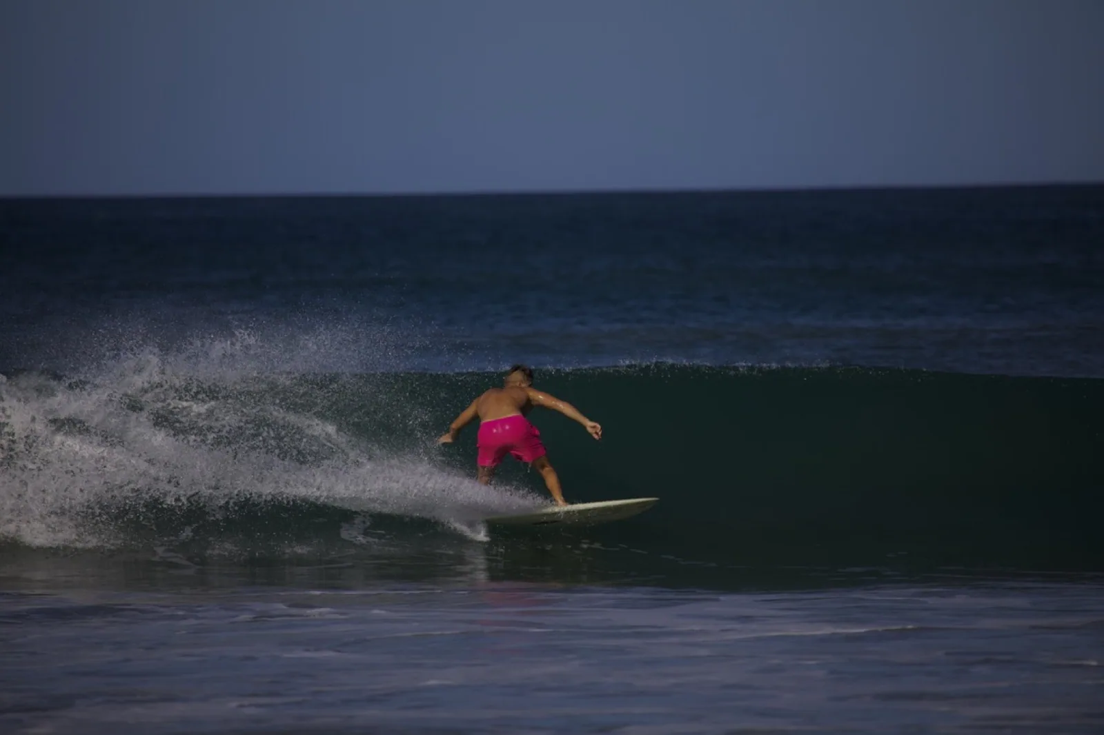 Surfing the beach break at Tamarindo