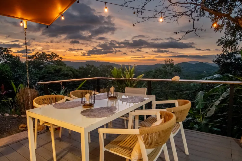 Sunset over the mountains from the deck dining table at Villa Lunax