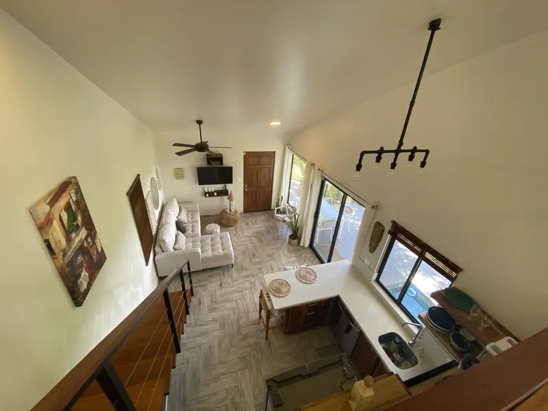 The view from the loft at Villa Lunax down over the living room and kitchen