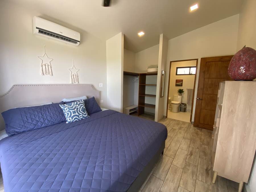 The bedroom at Casa Lunax, with its walk-in closet and ensuite