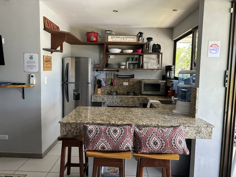 The kitchen and granite breakfast bar at Villa Sol