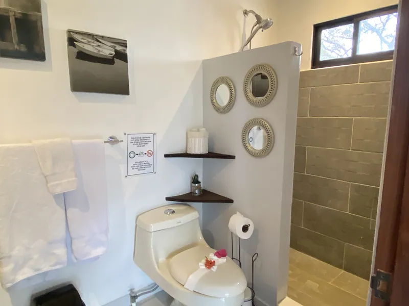 The upstairs bathroom at Villa Sol with a tiled walk-in shower