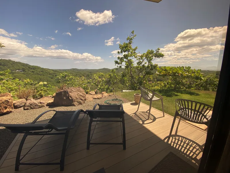 The private deck off the master bedroom, loungers and a garden edge